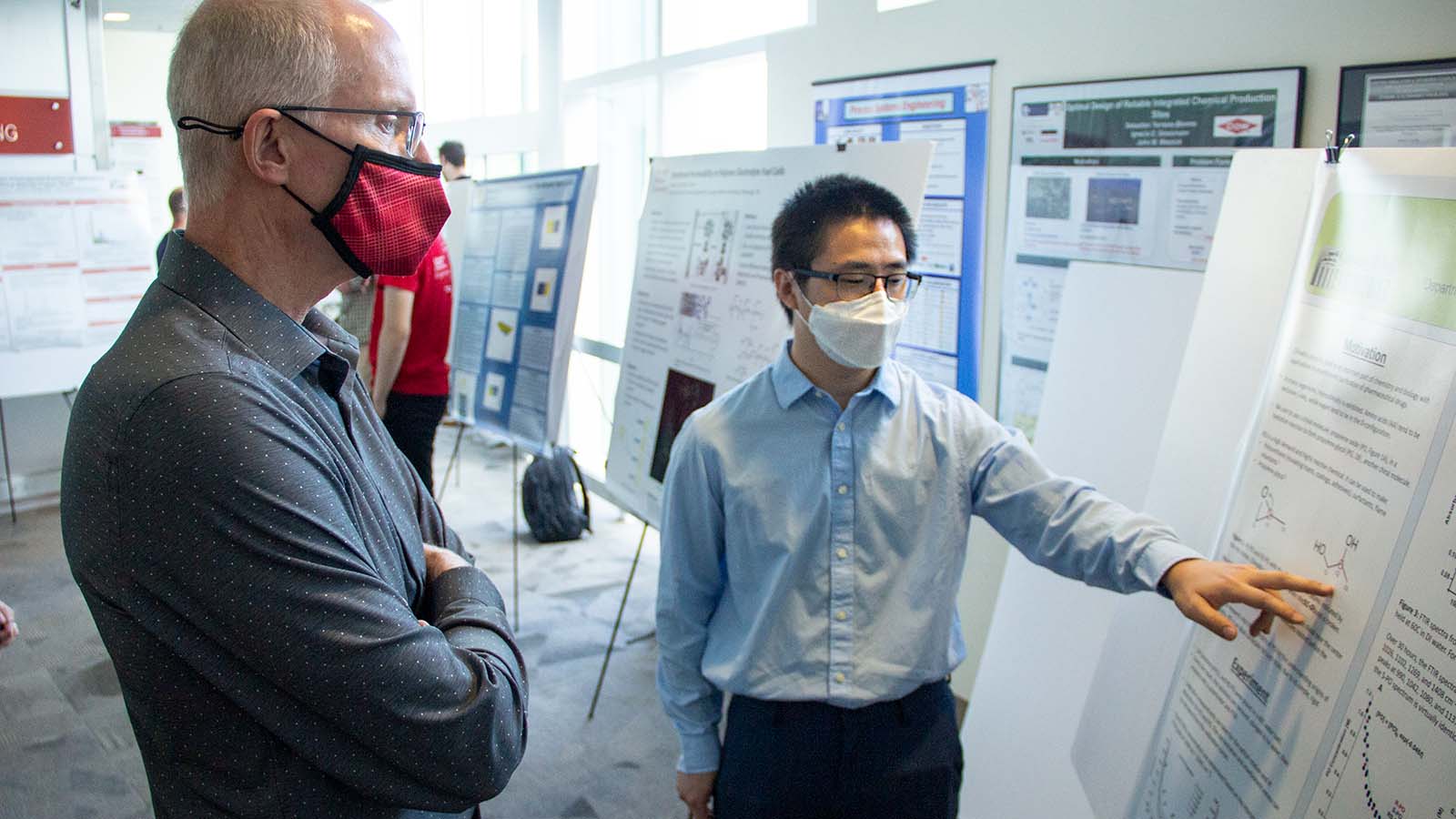 students show off posters at 6th annual berg symposium