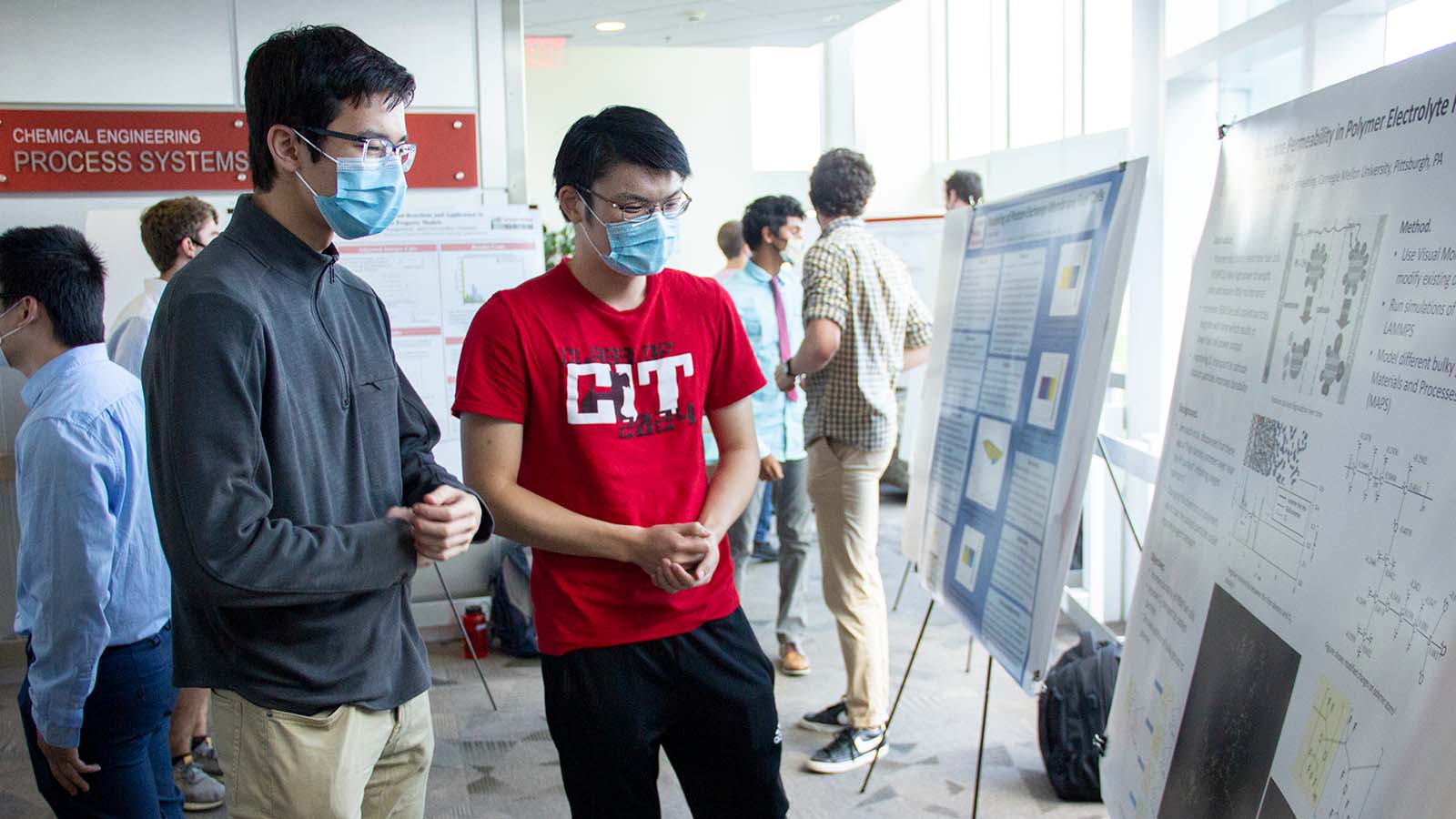 students show off posters at 6th annual berg symposium