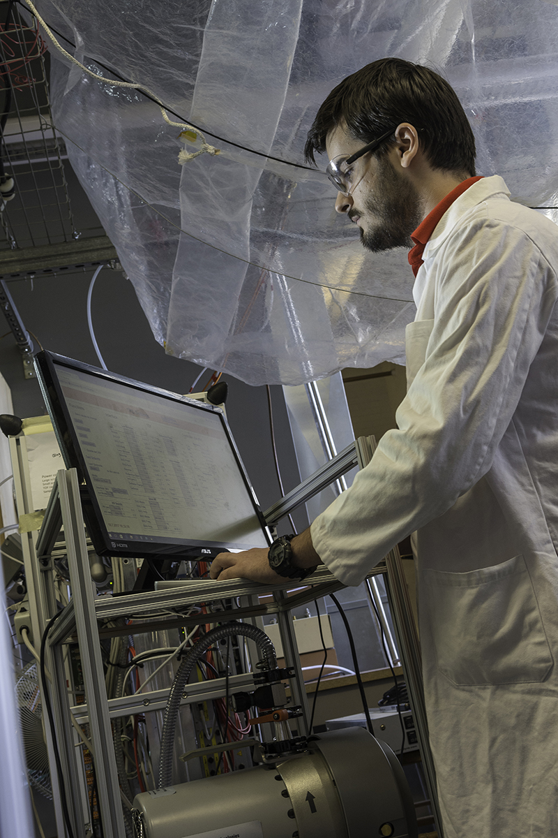 Student in a lab at a standing desk