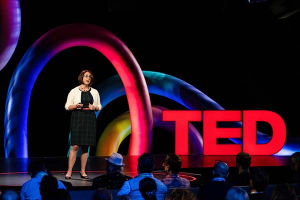 CMU ChemE Associate Professor Katie Whitehead on stage during her TED Talk