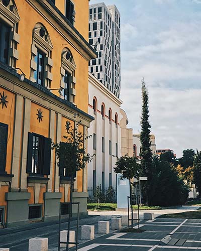 Landscape photo by Dasia Aldarondo - Image shows row of buildings and parking lot