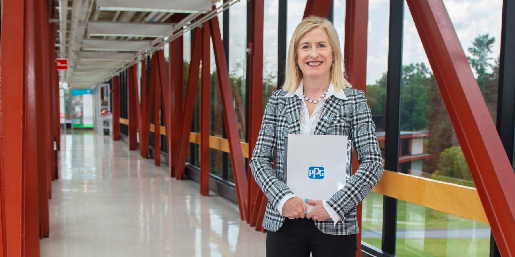 Rebecca Liebert poses for a picture inside hallway at PPG