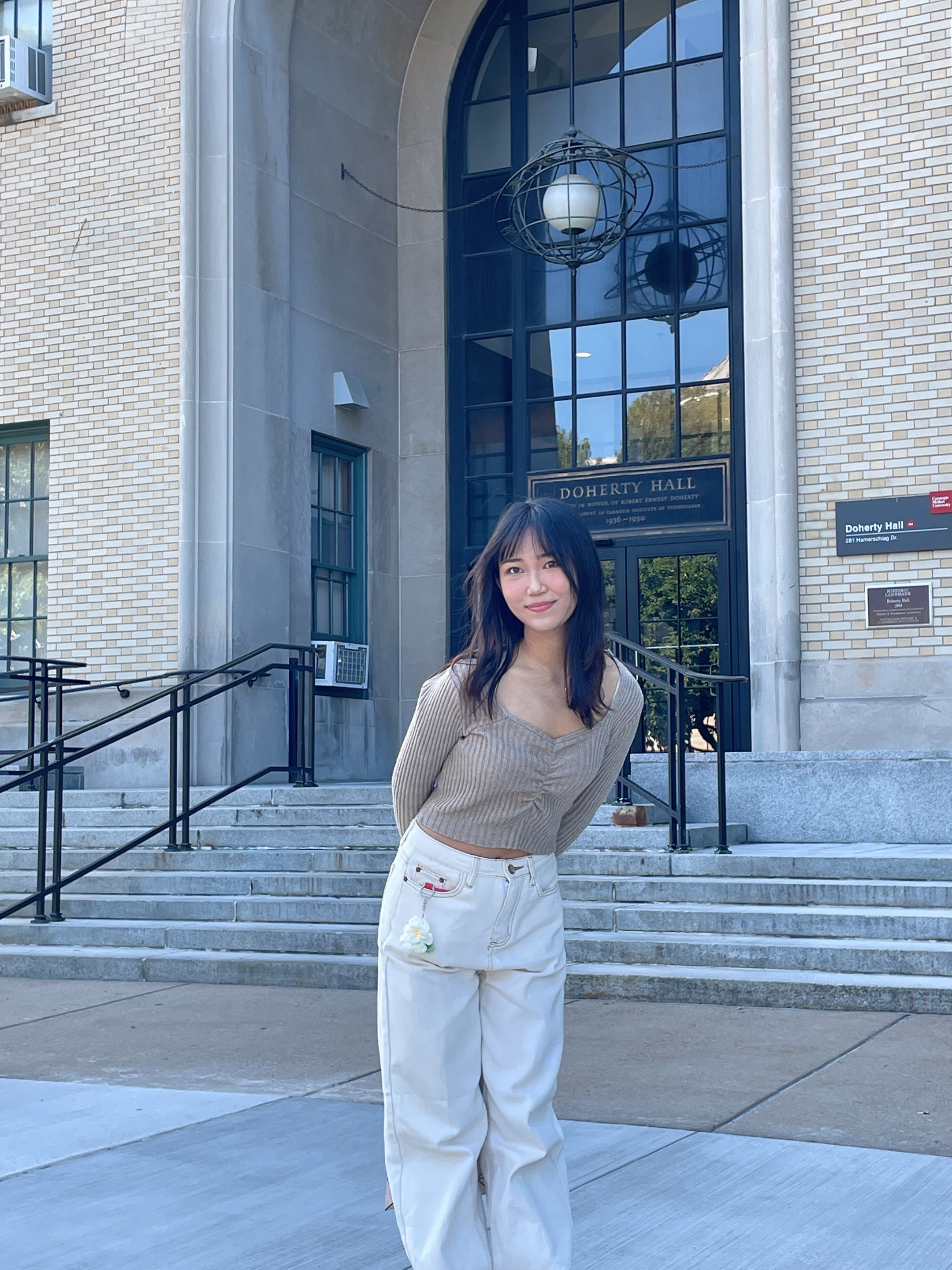 Yunfei Niu stands in front of Doherty Hall