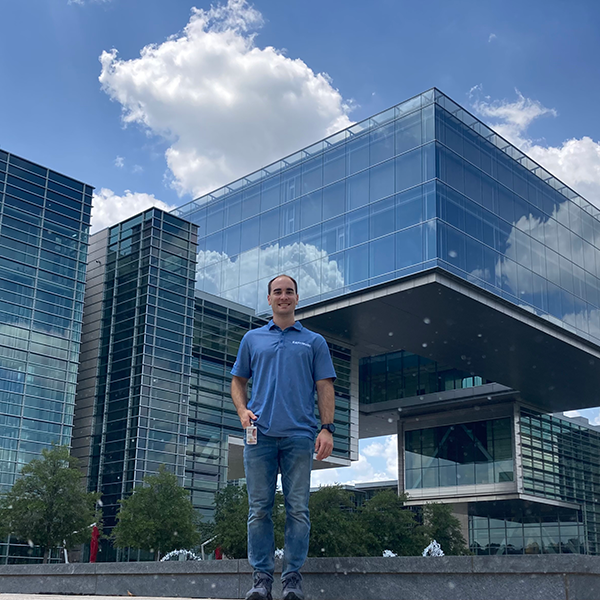 Tom Krumpolc standing in front of an office building