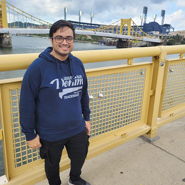 Javal Vyas standing on a bridge in Pittsburgh