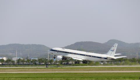 An airplane taking off from a runway