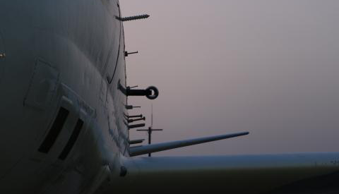 Short bars and wires protruding from the side of an airplane