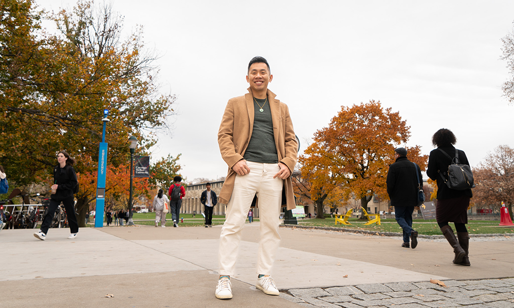 Lenny An standing outside with the CMU quad in the background