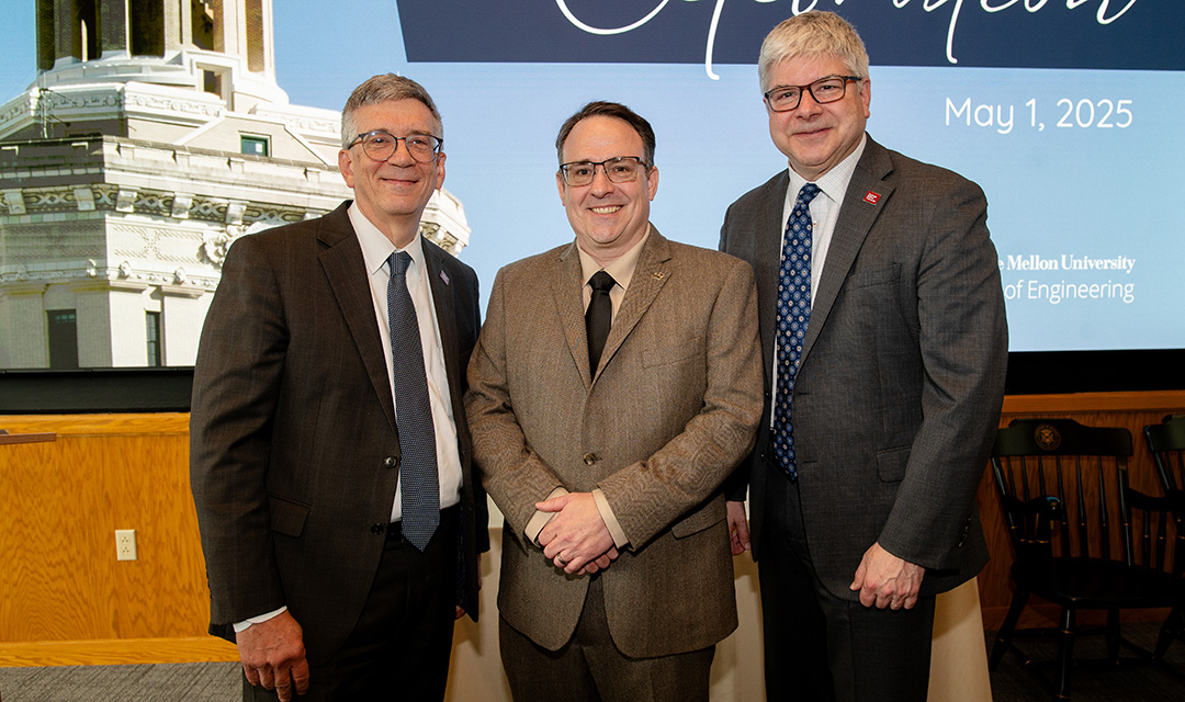 Provost James Garrett, Carl Laird, and Dean William Sanders pose for a photo.