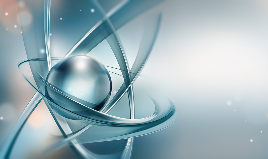 Abstract representation of an atom close-up. A silver sphere is encircled by three blue-gray orbits at different orientations.